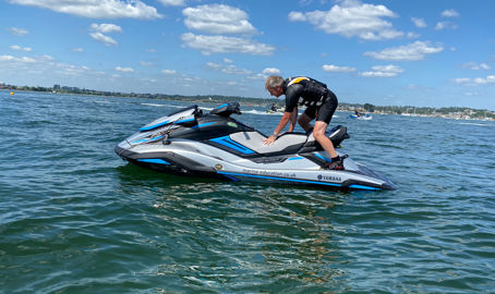 Long shot of man on his personal watercraft