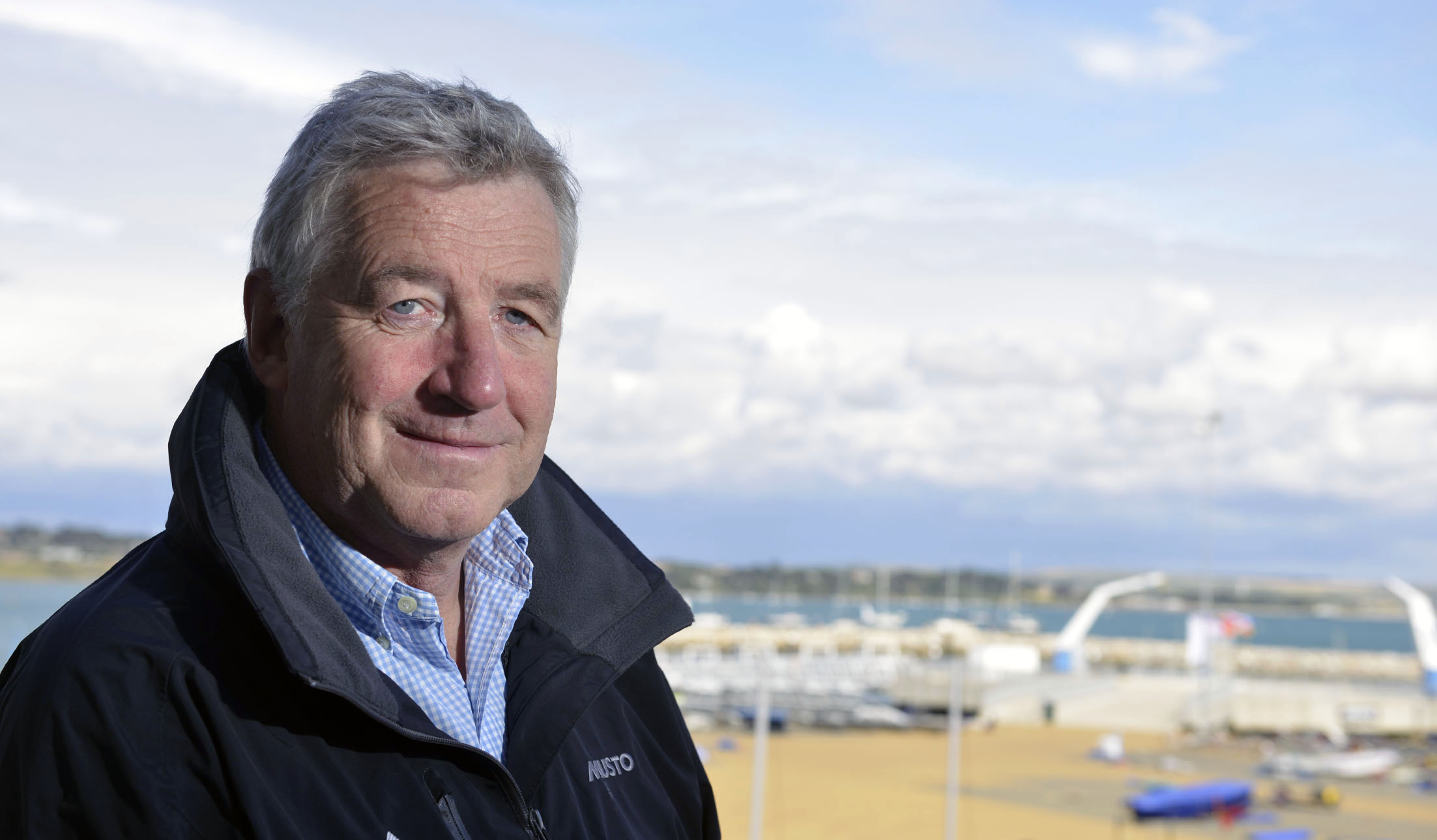 Profile photo of Pete Allam posing in front of the water