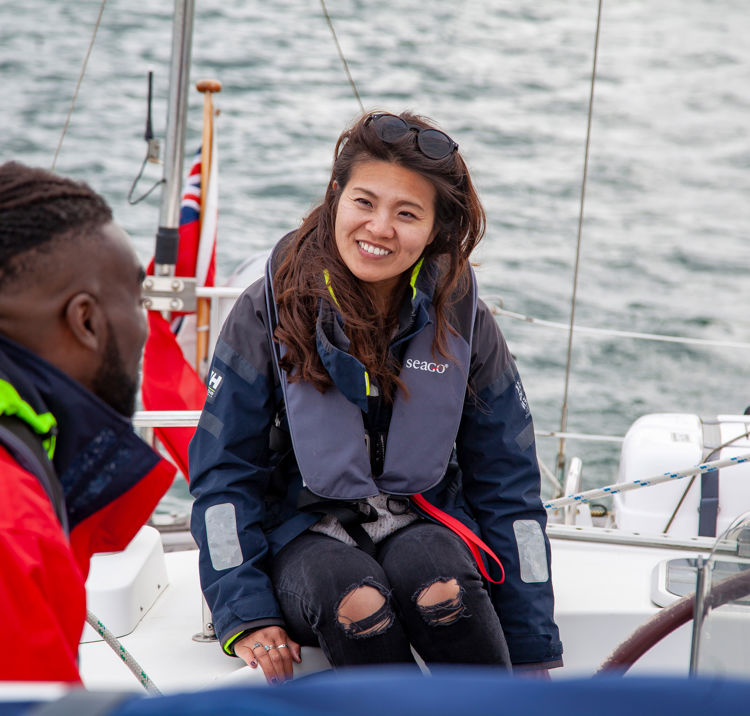 Two People Talking Wearing Life Jackets