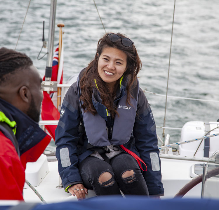 Two People Talking Wearing Life Jackets