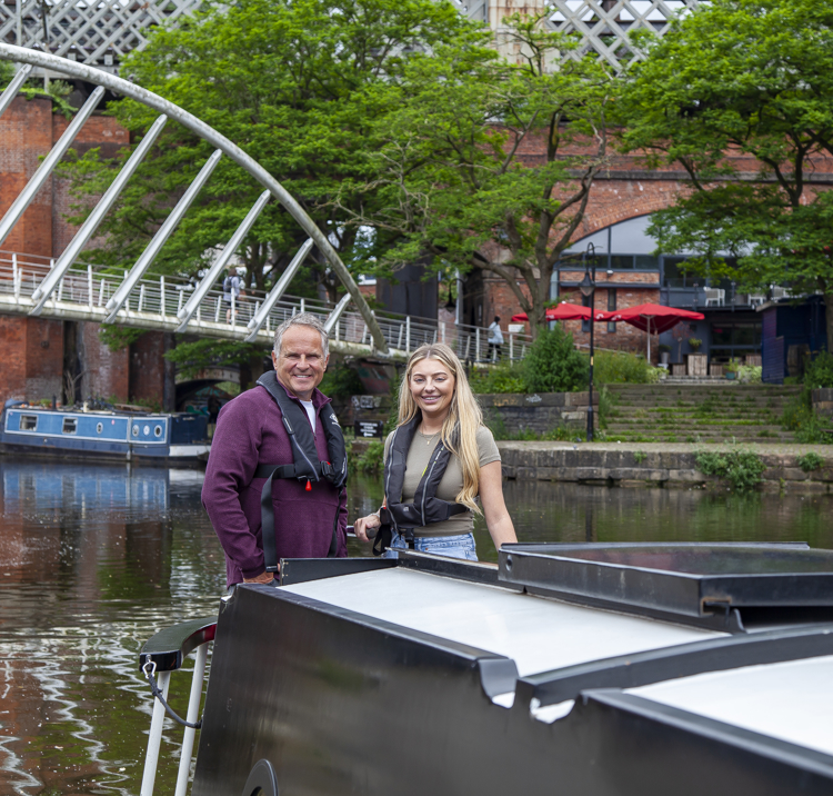 family enjoying the day on a narrowboat