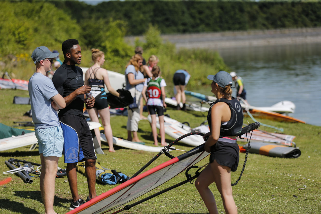 Sailing centre community on the shore before a session