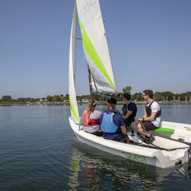 Group of sailors on a dinghy during training session