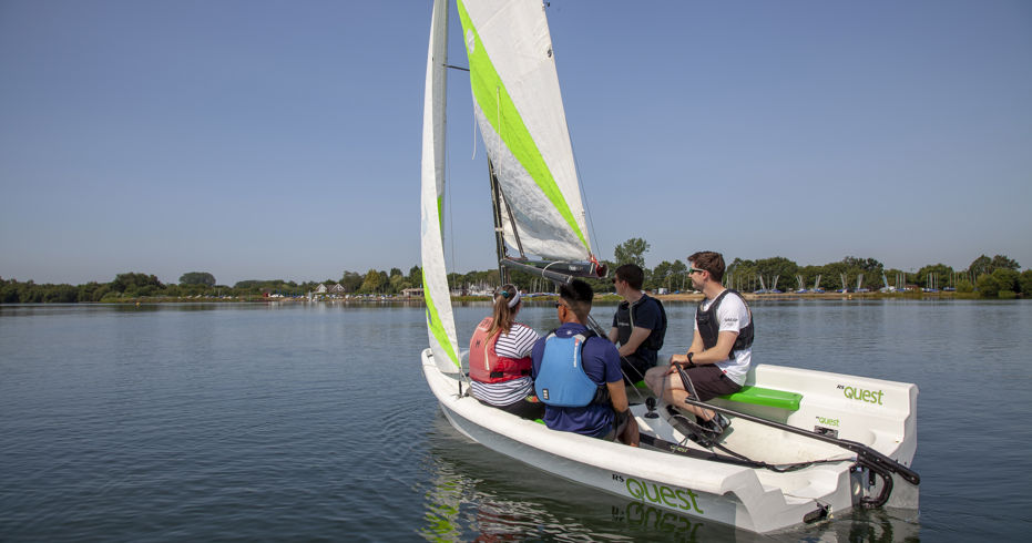 Group of sailors on a dinghy during training session
