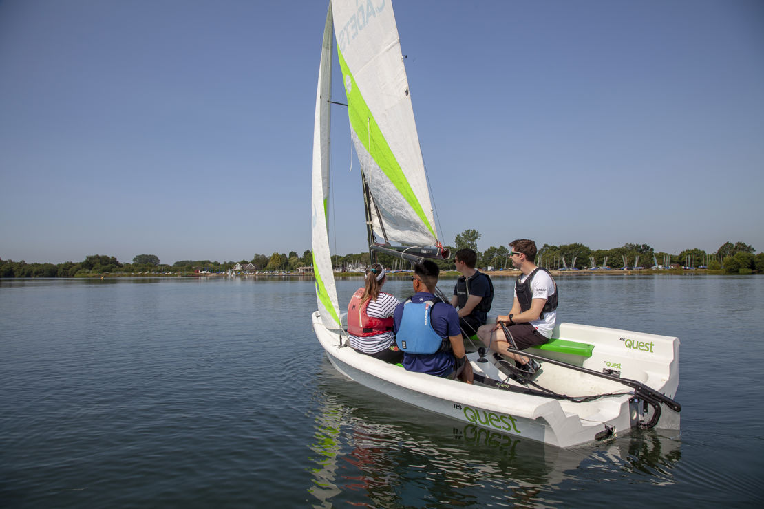 Group of sailors on a dinghy during training session
