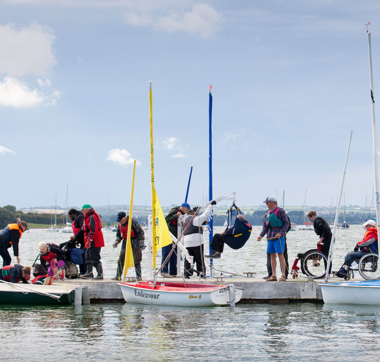 A group of sailors getting ready to start their session 