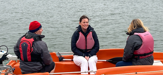 RYA CEO Sara Sutcliffe afloat on a safety boat during her tour of south west clubs and training centres