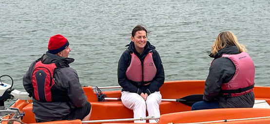 RYA CEO Sara Sutcliffe afloat on a safety boat during her tour of south west clubs and training centres