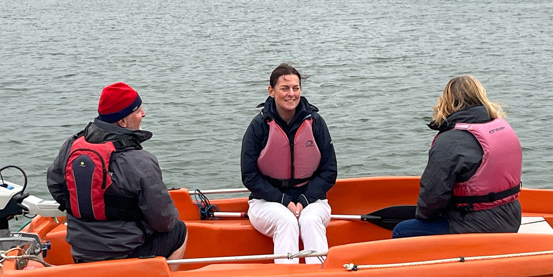 RYA CEO Sara Sutcliffe afloat on a safety boat during her tour of south west clubs and training centres