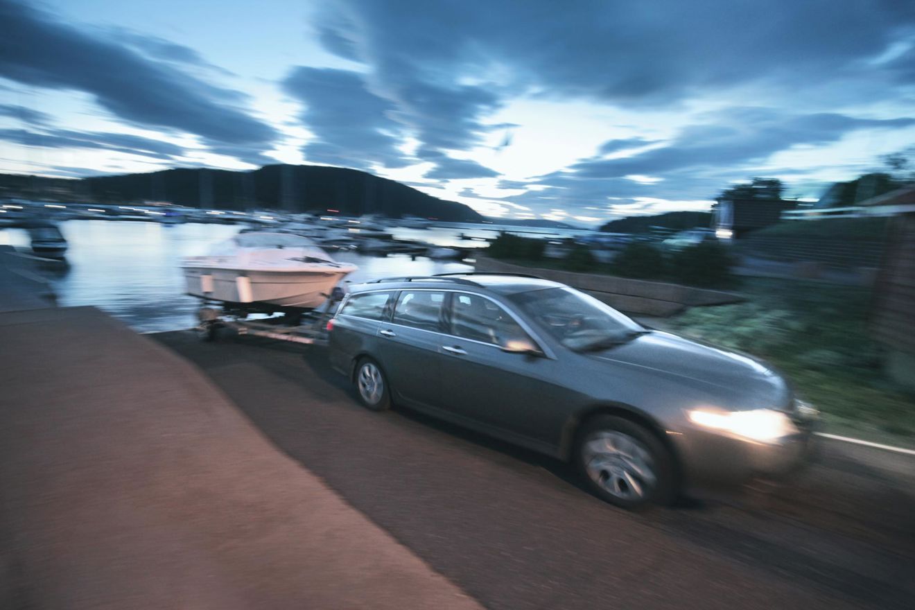 Car being towed out of the water by a car