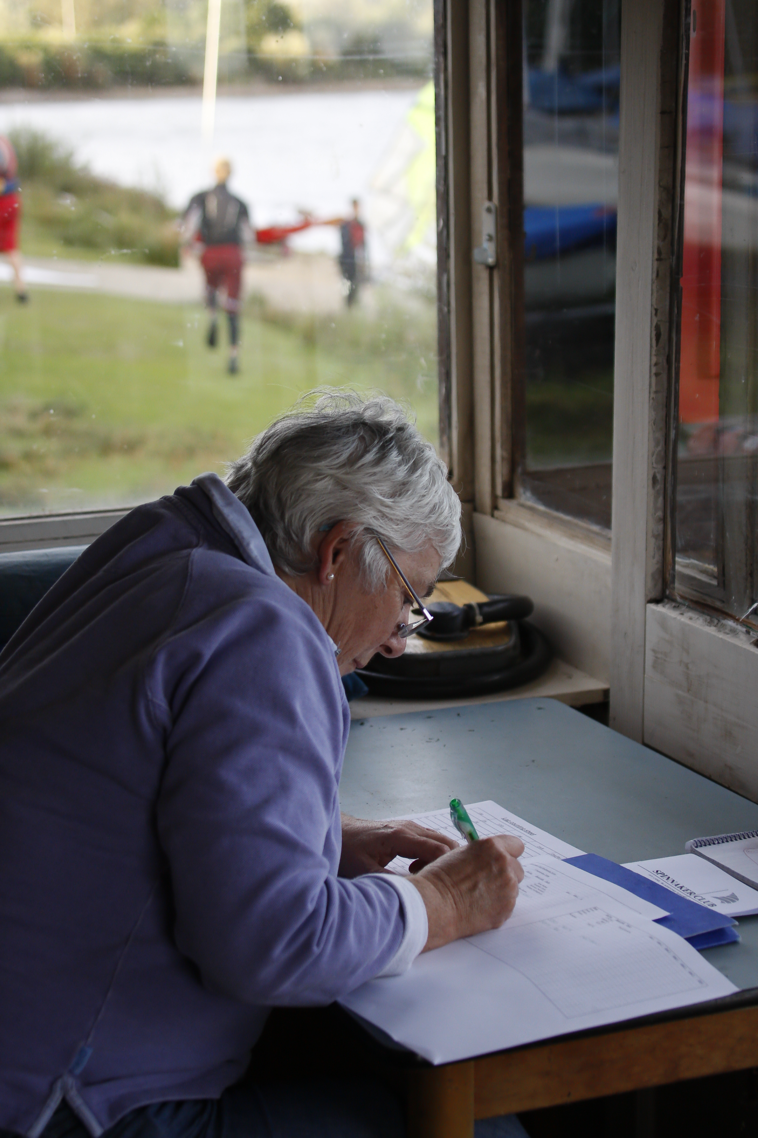 Over the shoulder shot of volunteer completing paperwork