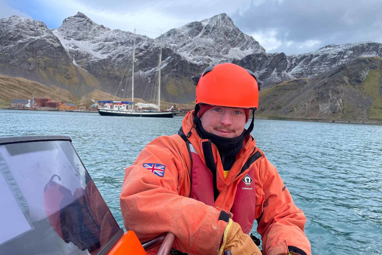 Louis Day sat on boat in the Antarctic