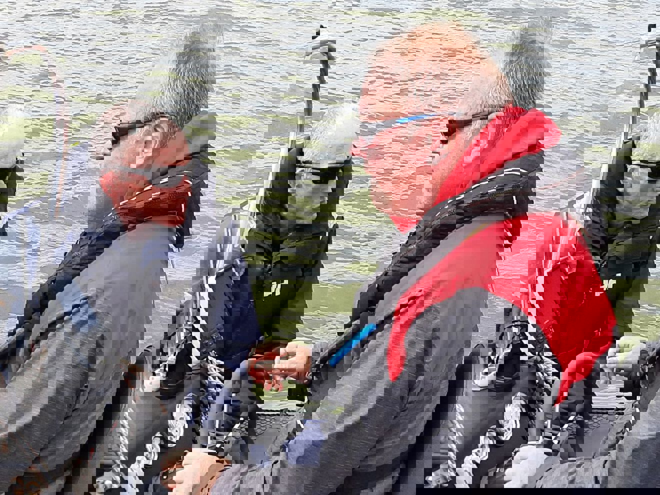 Dave Kelly (in red) on the helm of the rib with Phil Hastain (in black)