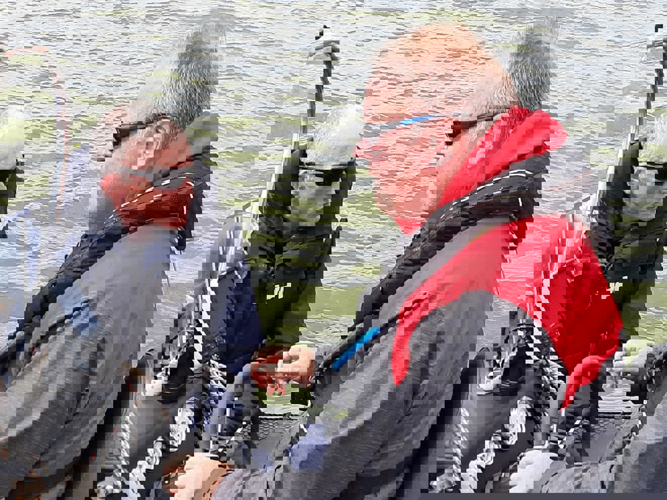 Dave Kelly (in red) on the helm of the rib with Phil Hastain (in black)