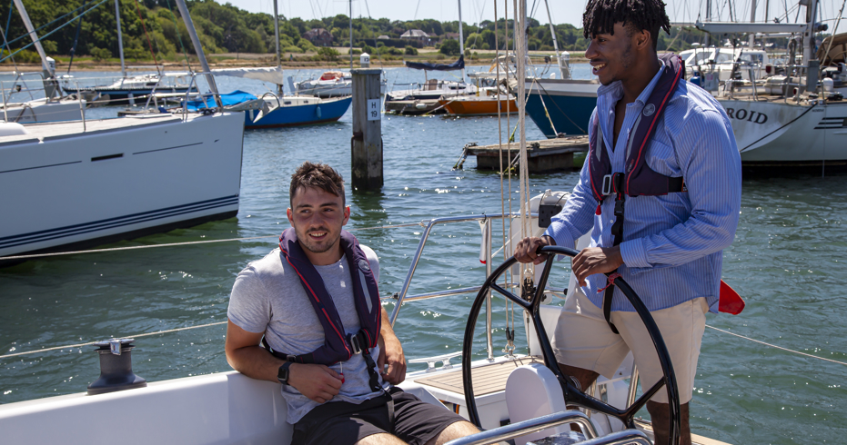 Two men on a boat in sunny weather