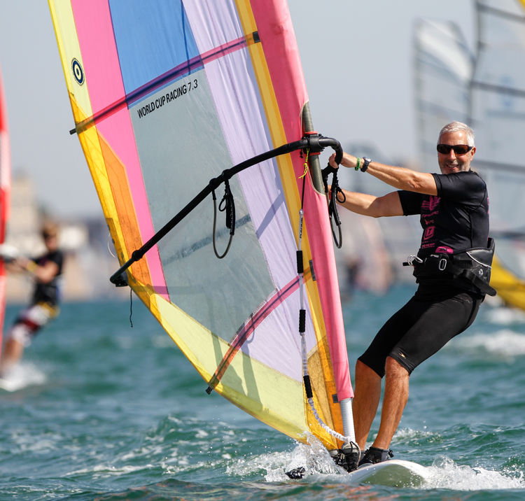 older gentleman windsurfing