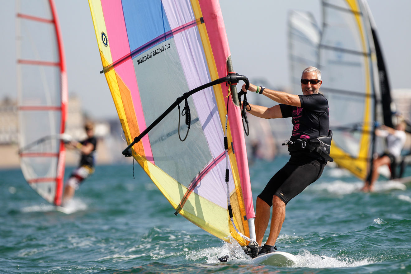 older gentleman windsurfing
