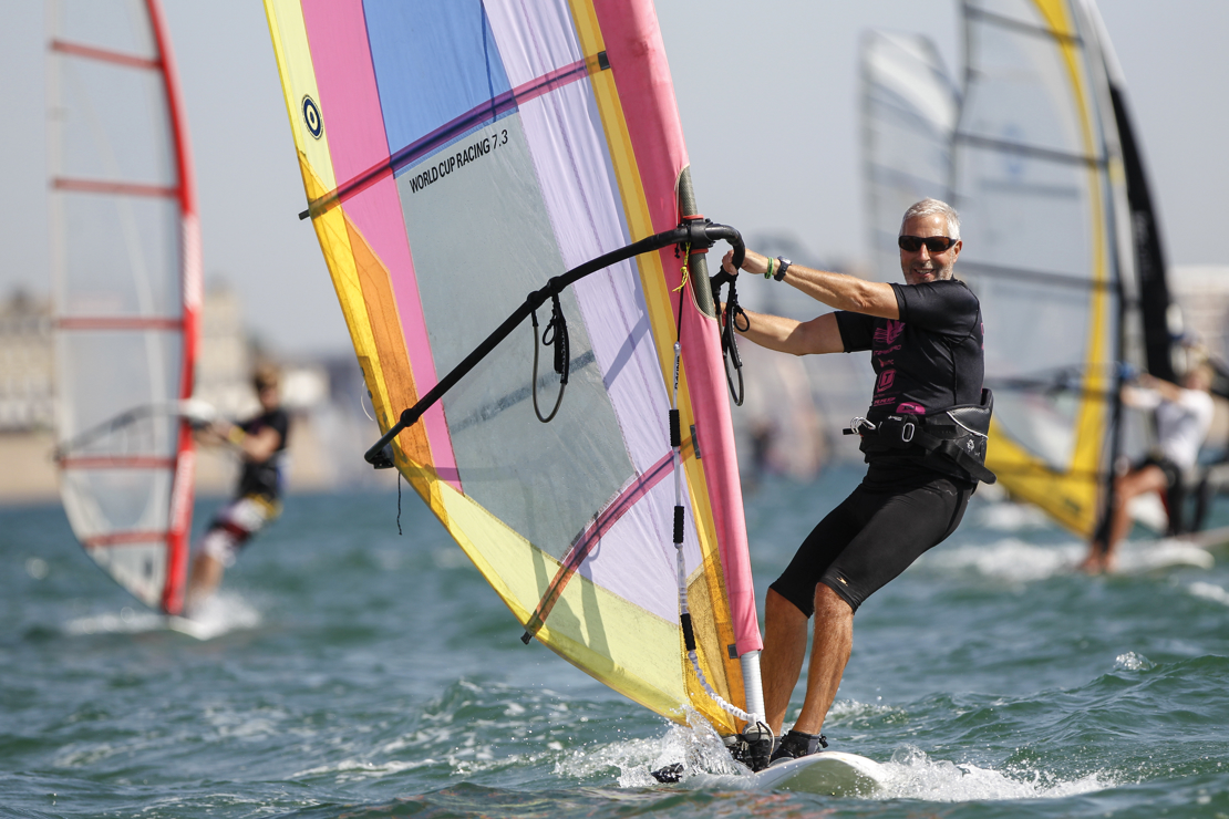 older gentleman windsurfing