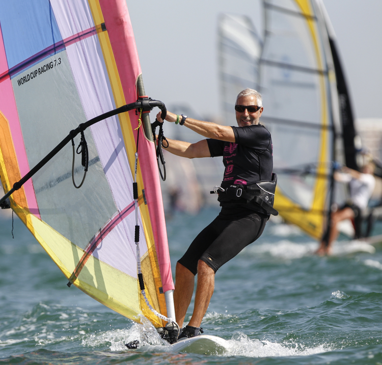 older gentleman windsurfing