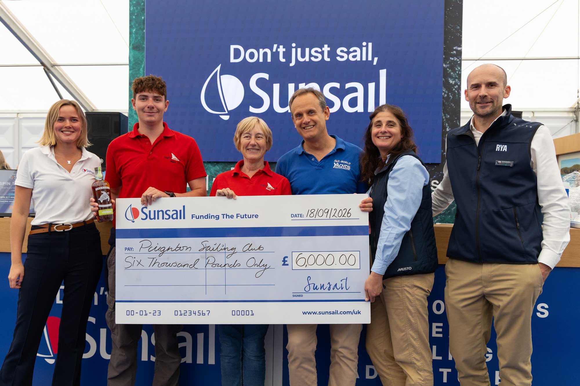Paignton Sailing Club, winners of the 2026 Funding the Future initiative being presented with a cheque for £6000 at the Southampton International Boat Show