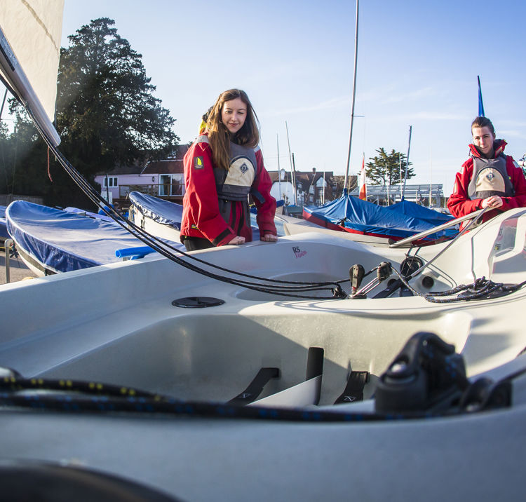 members stood near their boat