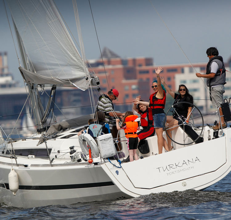 Yacht With Women Waving City Backdrop
