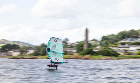 person wingsurfing on the river