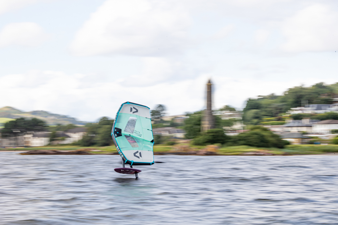 person wingsurfing on the river