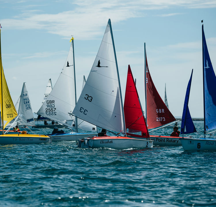 Colourful sails of dinghies on the water
