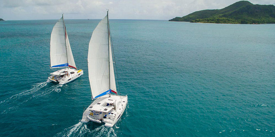 Wide photo of two boats sailing