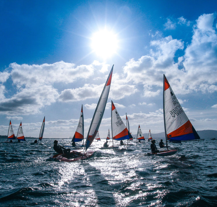dinghies surrounded by blue sky and water