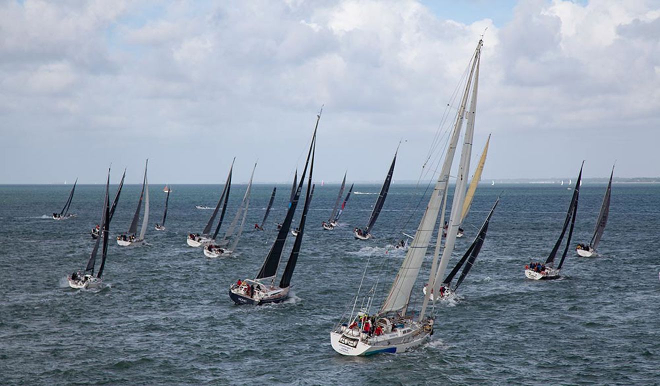 numerous sailing yachts in the ocean racing