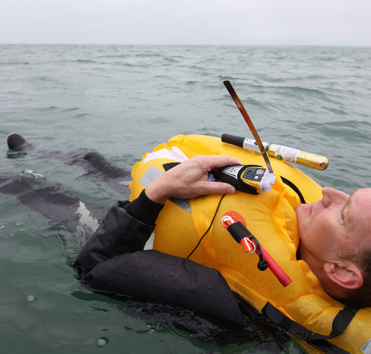 Man in lifejacket floating in the water