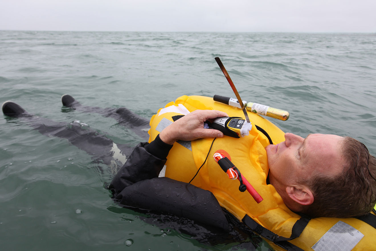 Man in lifejacket floating in the water