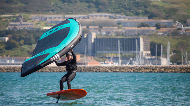 wingsurfer surfing on the water
