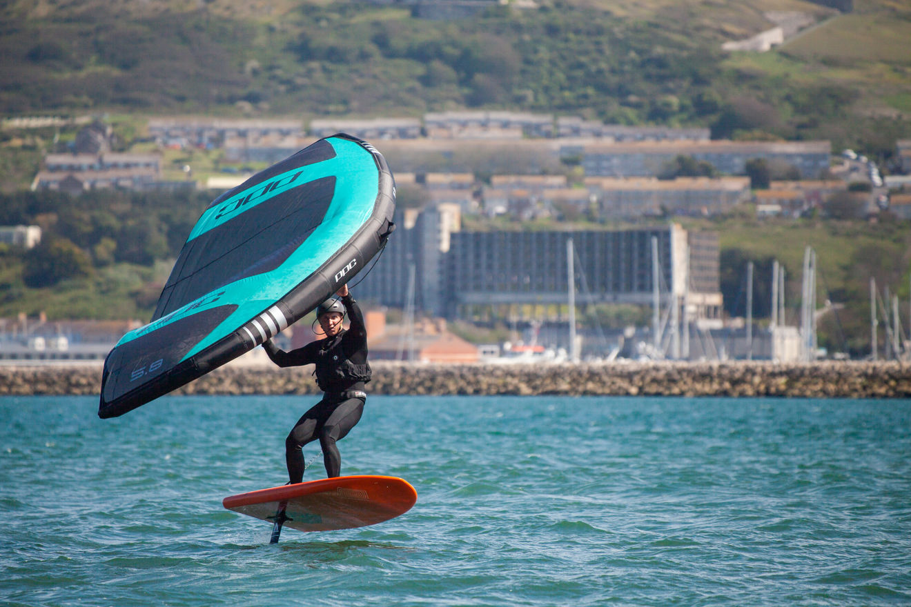wingsurfer surfing on the water