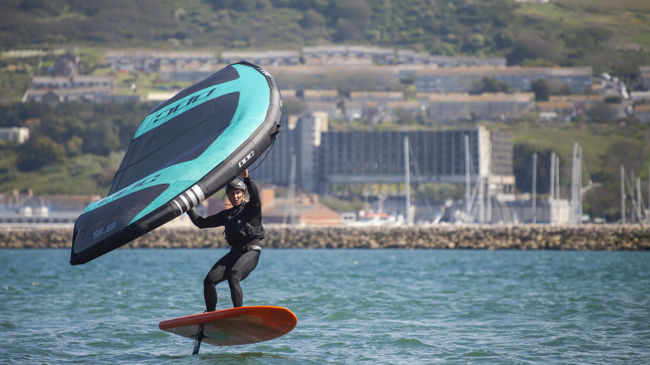 wingsurfer surfing on the water