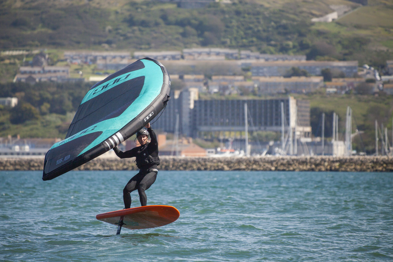 wingsurfer surfing on the water