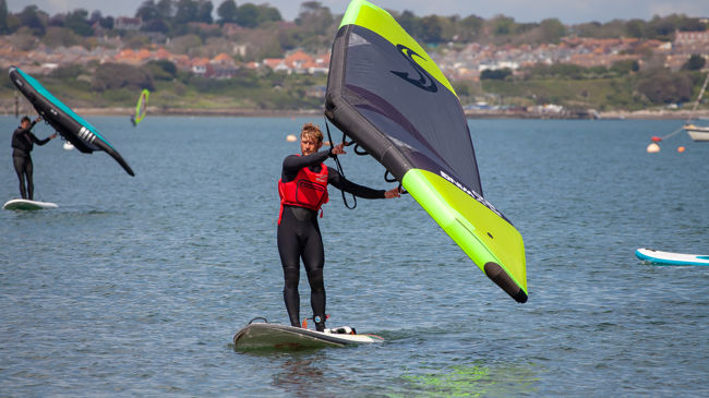 2 wingsurfers practicing on the water