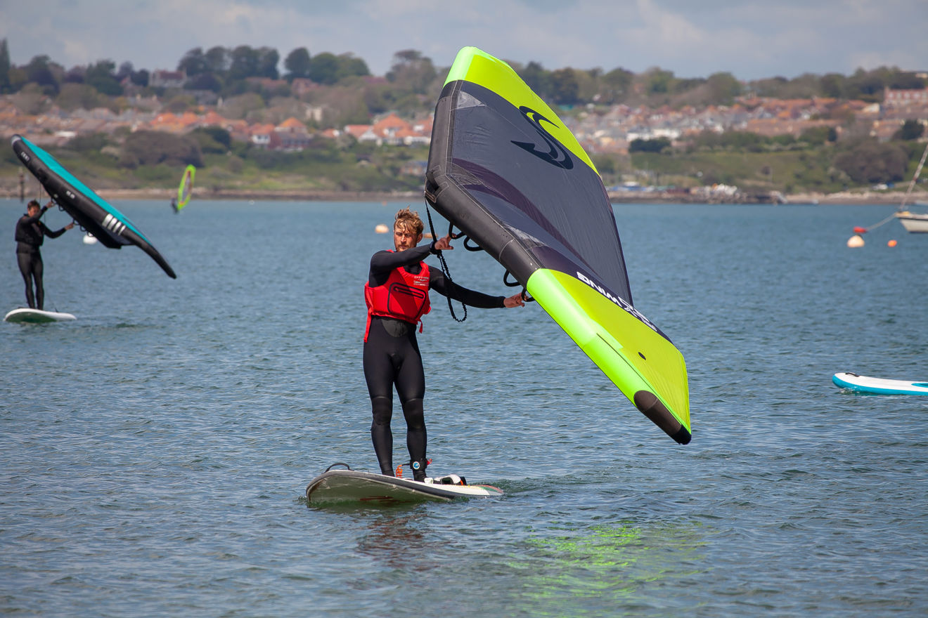 2 wingsurfers practicing on the water