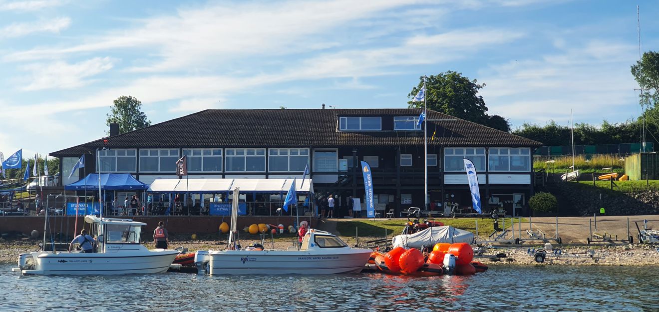 Mid shot of Draycote sailing club from the water on a sunny day