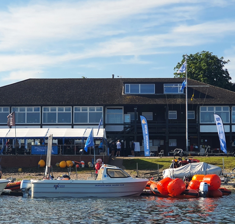 Mid shot of Draycote sailing club from the water on a sunny day