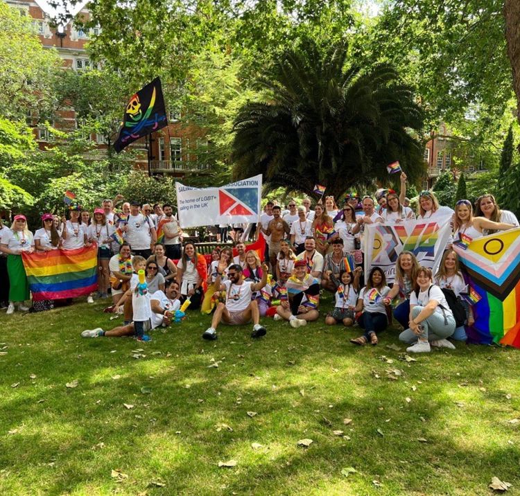 Group photo of sailors enjoying pride party