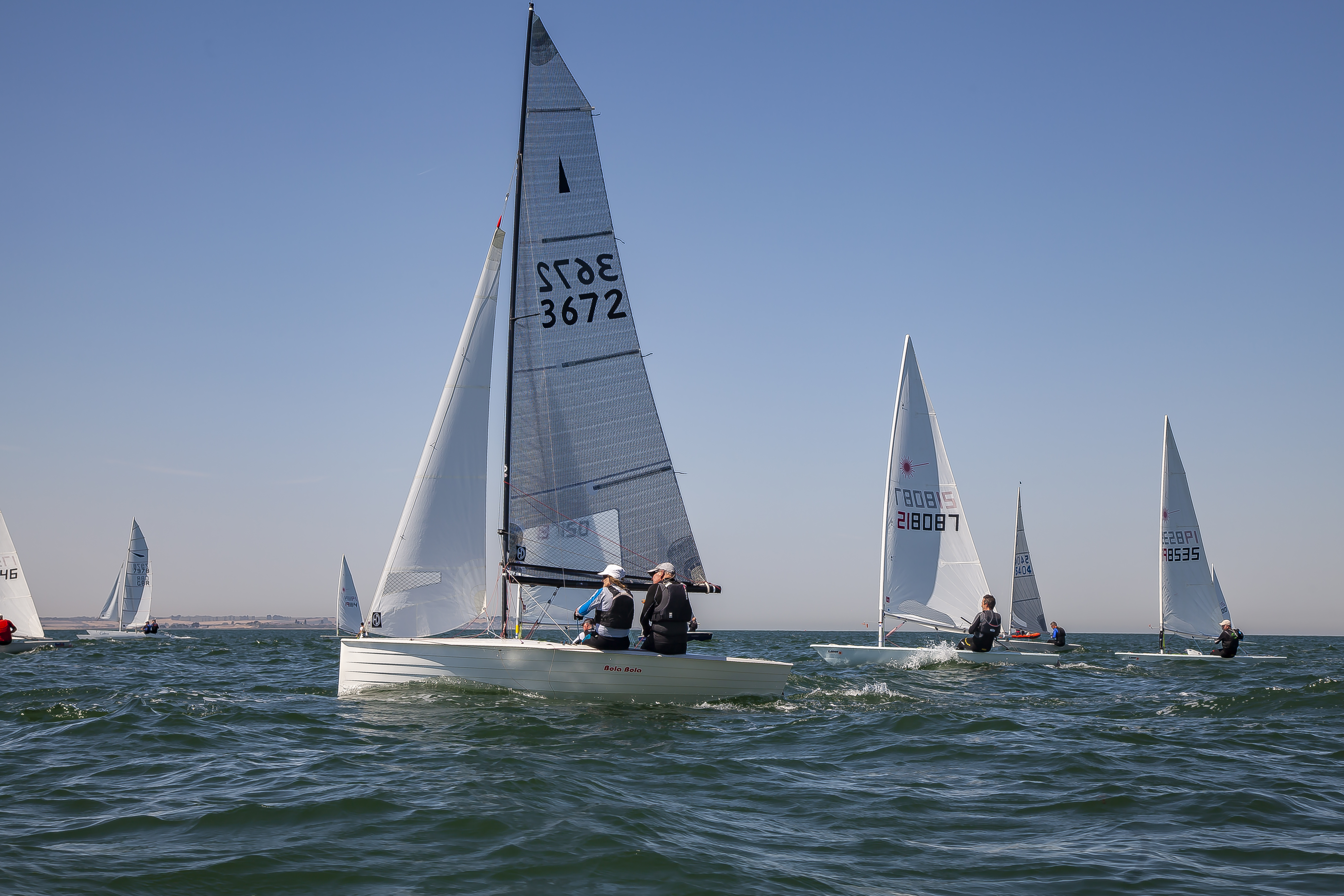 	An image of boats sailing across on the sea