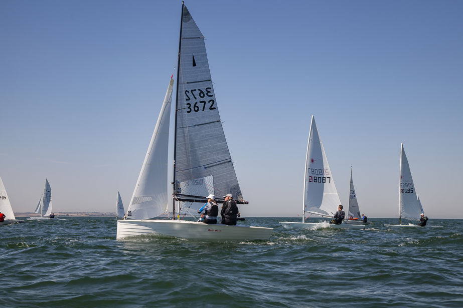 	An image of boats sailing across on the sea