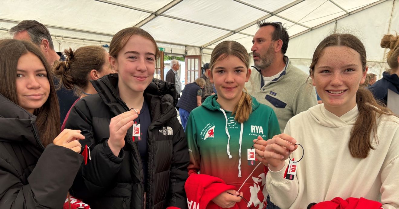 Welsh sailors at the Eric Twiname Junior Championships with their Welsh Sail / Hwyl Cymru keyrings.