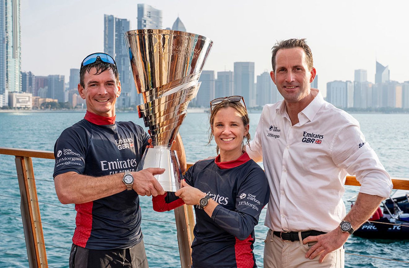 Dylan Fletcher, Hannah Mills and Sir Ben Ainslie celebrate 2025 season victory. Image Andrew Baker for SailGP