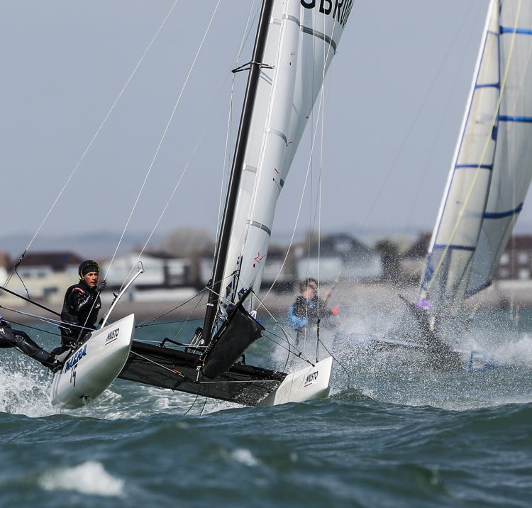 Watersports enthusiasts cutting through the waves