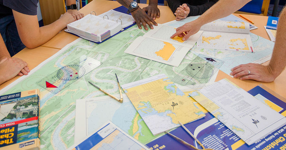 closeup of people looking at charts as part of a training exercise