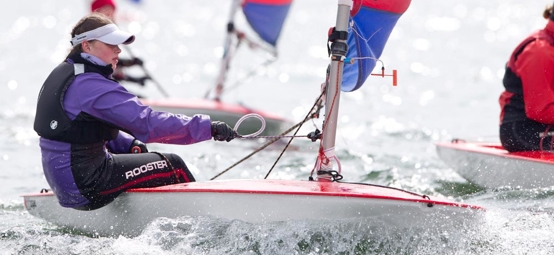 close up of young woman sailing on a dinghy